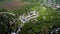 Aerial view of the ruins of a large medieval castle in Europe.