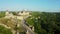 Aerial view of the ruins of a large medieval castle in Europe.