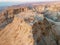 Aerial view  of the ruins of Massada is a fortress built by Herod the Great on a cliff-top off the coast of the Dead Sea.