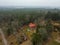 Aerial view of a rural farmstead situated in a wooded area