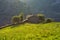 Aerial view of a rural house on a field in Valles Pasiegos, Picos de Europa, Cantabria