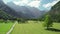 Aerial view of a rural road in alpine scenery of Logar valley, Slovenia