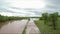 Aerial view of a rural road and pastureland under water after heavy rains inundated the region