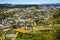 Aerial view of a rural town with well-groomed farms near Da Lata