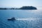 Aerial view of a sailboat drifting peacefully on a tranquil body of water in Kusadasi, Turkey