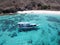 Aerial view of sailboat with island under blue sky in Labuan Bajo near Bali Island, Indonesia