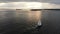 Aerial view of sailboat during Sunset on the Hudson River with Liberty island on the background. NYC
