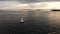 Aerial view of sailboat during Sunset on the Hudson River with Liberty island on the background. NYC