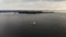 Aerial view of sailboat during Sunset on the Hudson River with Liberty island on the background. NYC