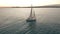 Aerial view. Sailing yacht on the sea at the sunset.
