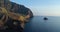 Aerial view of Salina coast, deep cliff, little village in a summer sunset. Blue sea, sky and wind for a peaceful moment