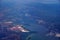 Aerial view of salt evaporation ponds, bridge, airports, cities