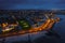 Aerial view on Salthill area of Galway city, Ireland. Night scene with illuminated roads, buildings and city lights and dark sky