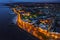 Aerial view on Salthill area of Galway city, Ireland. Night scene with illuminated roads, buildings and city lights and dark sky