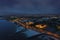 Aerial view on Salthill area of Galway city, Ireland. Night scene with illuminated roads, buildings and city lights and dark sky