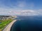 Aerial view, Salthill beach and Blackrock diving board, Tilt shift effect. Warm sunny day, Galway city, Ireland. Cloudy sky