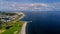 Aerial view, Salthill beach and Blackrock diving board, Tilt shift effect. Warm sunny day, Galway city, Ireland. Cloudy sky