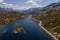 Aerial view of the San Bernardino Pass in the Swiss Alps. Pictured is Moesola Lake and its little islands, with the road skirting