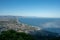 Aerial view San Felice Circeo, Italian city in province Latina on Tyrrhenian sea, with reflection in sea water of shadow of cross