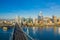 Aerial view of the San Francisco, California, skyline at sunrise. Ample copy space in blue sky. Bay Bridge in the foreground.