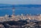 Aerial view of San Francisco skyline with Sutro tower in the foreground, fly over Twin Peaks