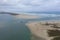 Aerial view of a sand dredger boat at the mouth of the Murray River in South Australia