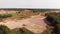 Aerial view of a sand, gravel mine quarry full with water.