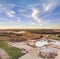 Aerial view of a sand, gravel mine quarry full with water