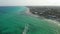 Aerial view of sandy beach along the seashore in Playa del Carmen. Picturesque seascape with holiday resorts on