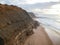 Aerial view from a sandy beach at the sunset with an amazing cliff