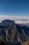 Aerial view of savage landscape with low clouds cover the forest and mountains