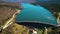 Aerial view of a scenic mountain reservoir lake and a Dam for hydroelectric power generation.