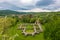 Aerial view about Schlossberg church ruins surrounded by forest.