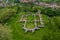 Aerial view about Schlossberg church ruins surrounded by forest.