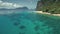 Aerial view of sea bay coast turquoise water with transport: passenger boats, vessels at sand beach