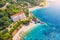 Aerial view with sea coast, sandy beach, blue water, hotels