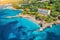 Aerial view with sea coast, sandy beach, blue water, hotels