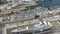 Aerial view of sea dry dock in La Ciotat city, France, the cargo crane, boats on repair, a luxury sail yacht and motor