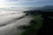 Aerial view of the sea of fog on a spring morning in the foothills