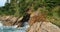 Aerial view of the sea and and leaking pipe on the rock in Phuket