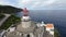 Aerial view of the sea lighthouse on the rock Farol Da Ponta Do Arnel- Sao Miguel Azores 15 octobre 2022