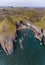 An aerial view from sea looking down into an isolated rocky cove on the Pembrokeshire coast near to Tenby, South Wales