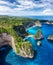 Aerial view at sea and rocks. Turquoise water background from top view. Summer seascape from air. Atuh beach, Nusa Penida, Bali, I