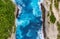 Aerial view at sea and rocks. Turquoise water background from top view. Summer seascape from air. Summer adventure.