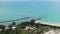 Aerial view of sea shore near Venice, Florida with white yachts floating on sea waves. North and South Jetty on Nokomis