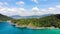 Aerial view of sea shore with rocks on island, rocky cape