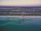 Aerial view of Seaford suburb in Melbourne and long wooden pier