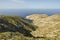 Aerial view of seascape and mountains.