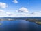 Aerial view of seashore with beach, lagoons. Coastline with sand and water. Landscape. Aerial photography. Birdseye. Sky, clouds.