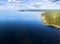 Aerial view of seashore with beach, lagoons. Coastline with sand and water. Landscape. Aerial photography. Birdseye. Sky, clouds.